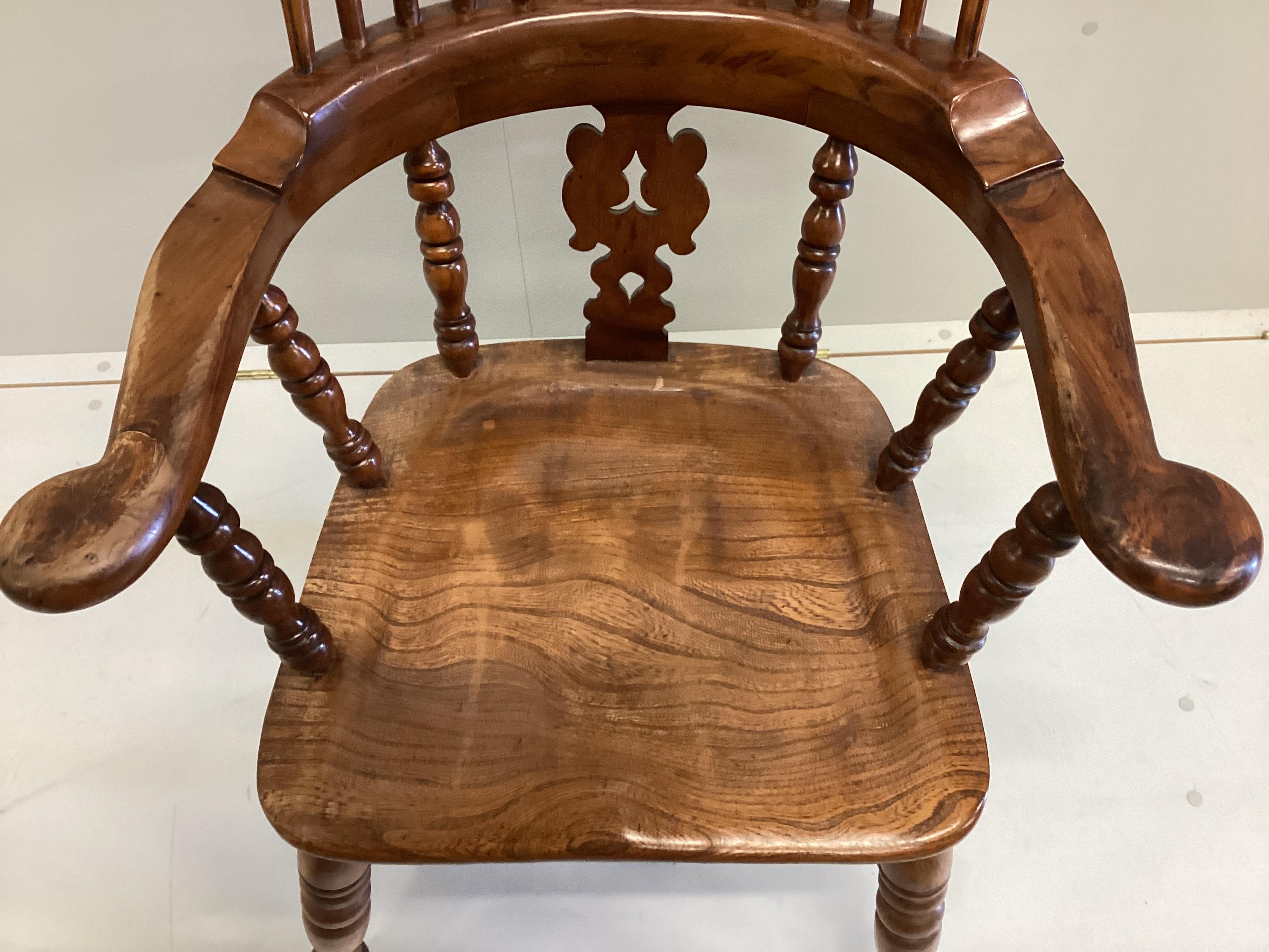 A reproduction yew and elm Yorkshire style Windsor armchair, width 64cm, depth 42cm, height 114cm.